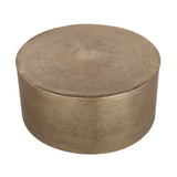 Bronze round metal coffee table with a smooth, textured surface.