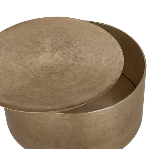 Bronze metal drum table with removable lid revealing storage space.