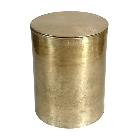 Gold cylindrical metal table with smooth finish.