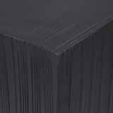 Dark wooden plinth showing layered texture detail.