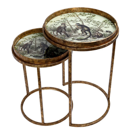 Two round nesting tables with monkey jungle design on top.