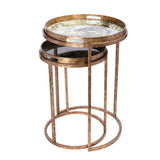 Bronze nesting tray tables with jungle-themed tops and circular bases.