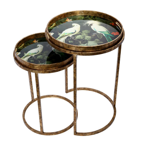 Antique gold side tables with tropical bird design on circular tops.