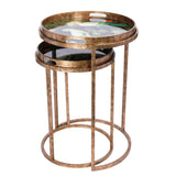 Bronze nesting tray tables with tropical bird design on top.