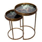 Bronze nesting tray tables with leopard design on tabletops.