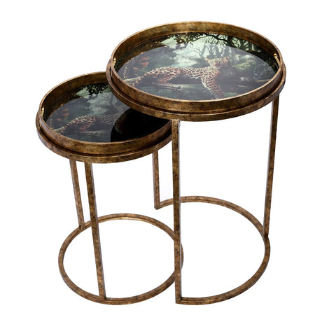 Bronze nesting tray tables with leopard design on tabletops.
