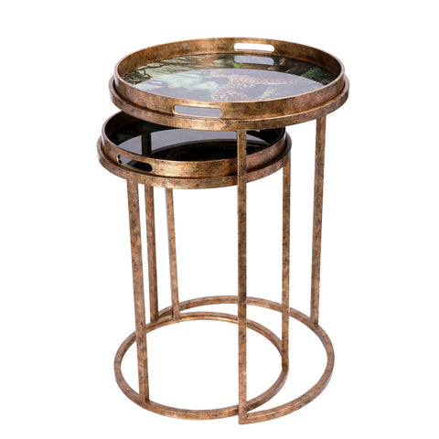 Bronze nesting tray tables with leopard design on top surface.