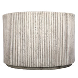 Beige cylindrical table with vertical ribbed texture.
