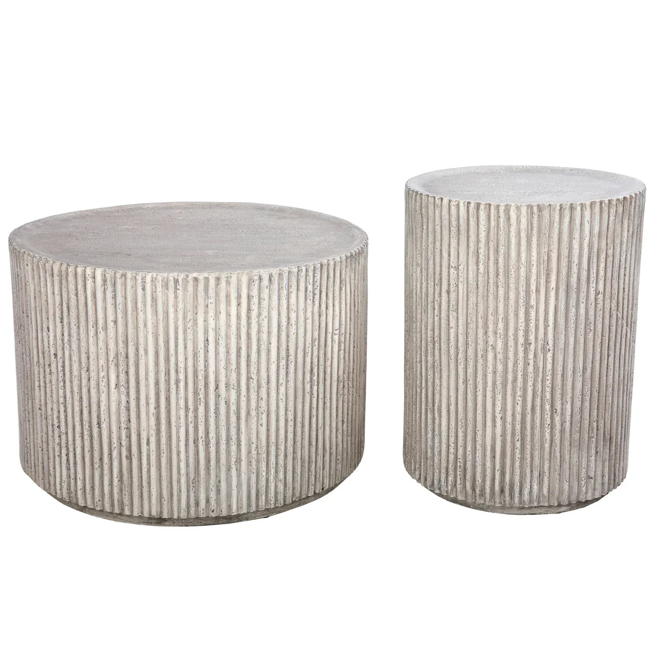 Ribbed concrete coffee tables in cylindrical shapes.
