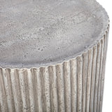 Textured grey surface with ribbed detailing on the side table.