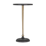 Black round side table with slender gold stem and textured base.