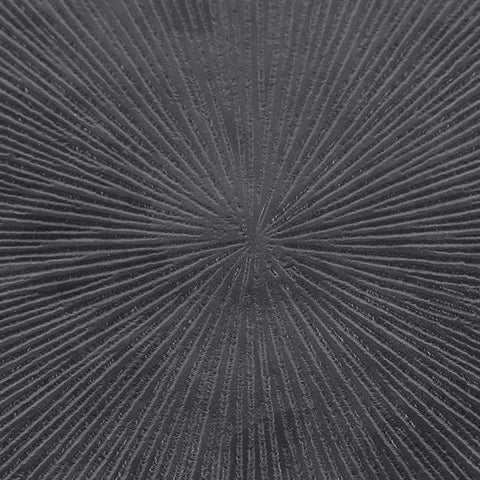 Dark textured table surface with radiating line pattern.