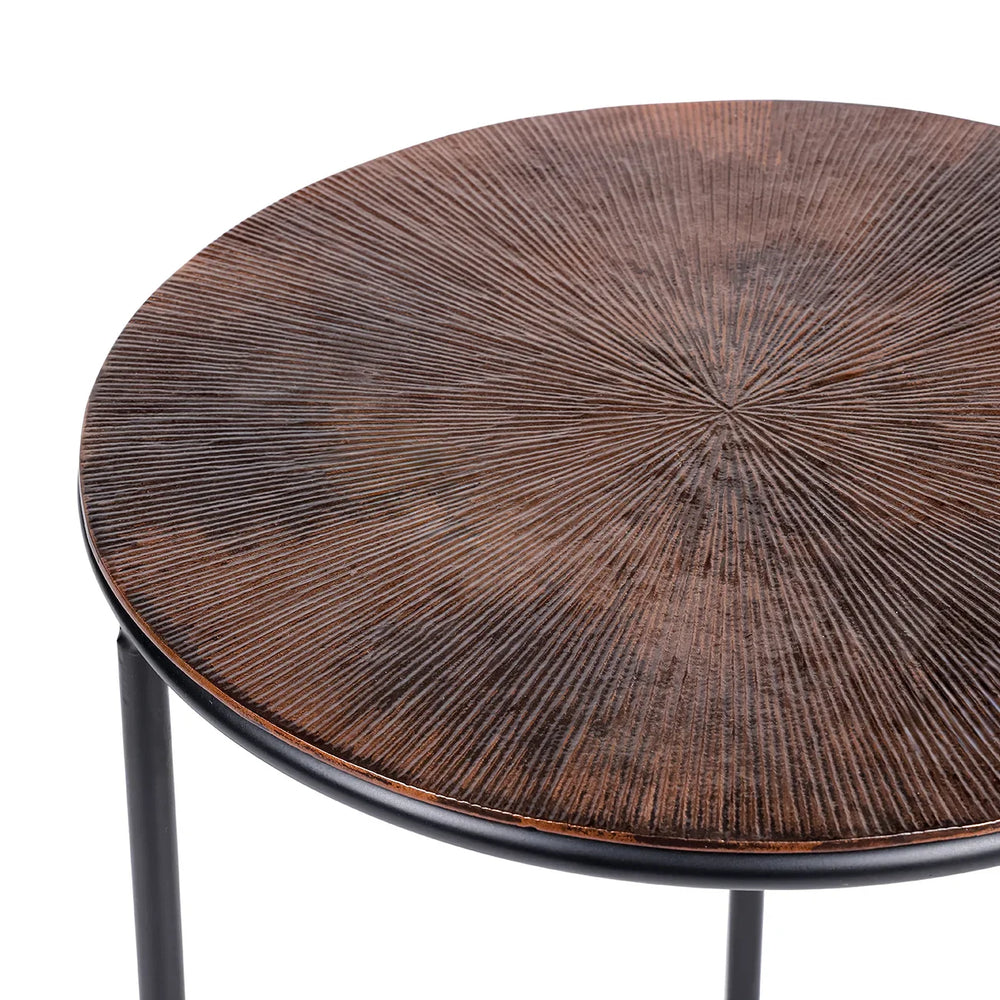 Brown metal table with radial textured surface and black legs.