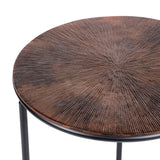 Brown metal table with radial textured surface and black legs.