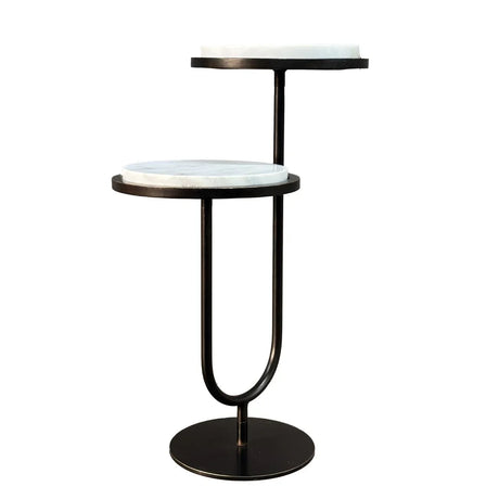 Two-tiered table with white marble tops and black metal frame.