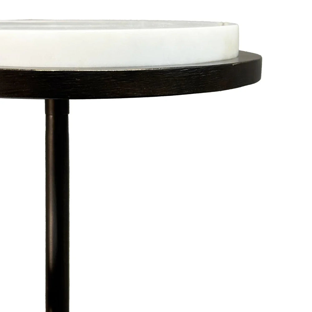 White marble tabletop with dark wood edge and slender black leg.