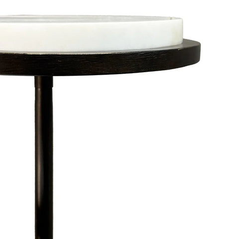 White marble tabletop with dark wood edge and slender black leg.