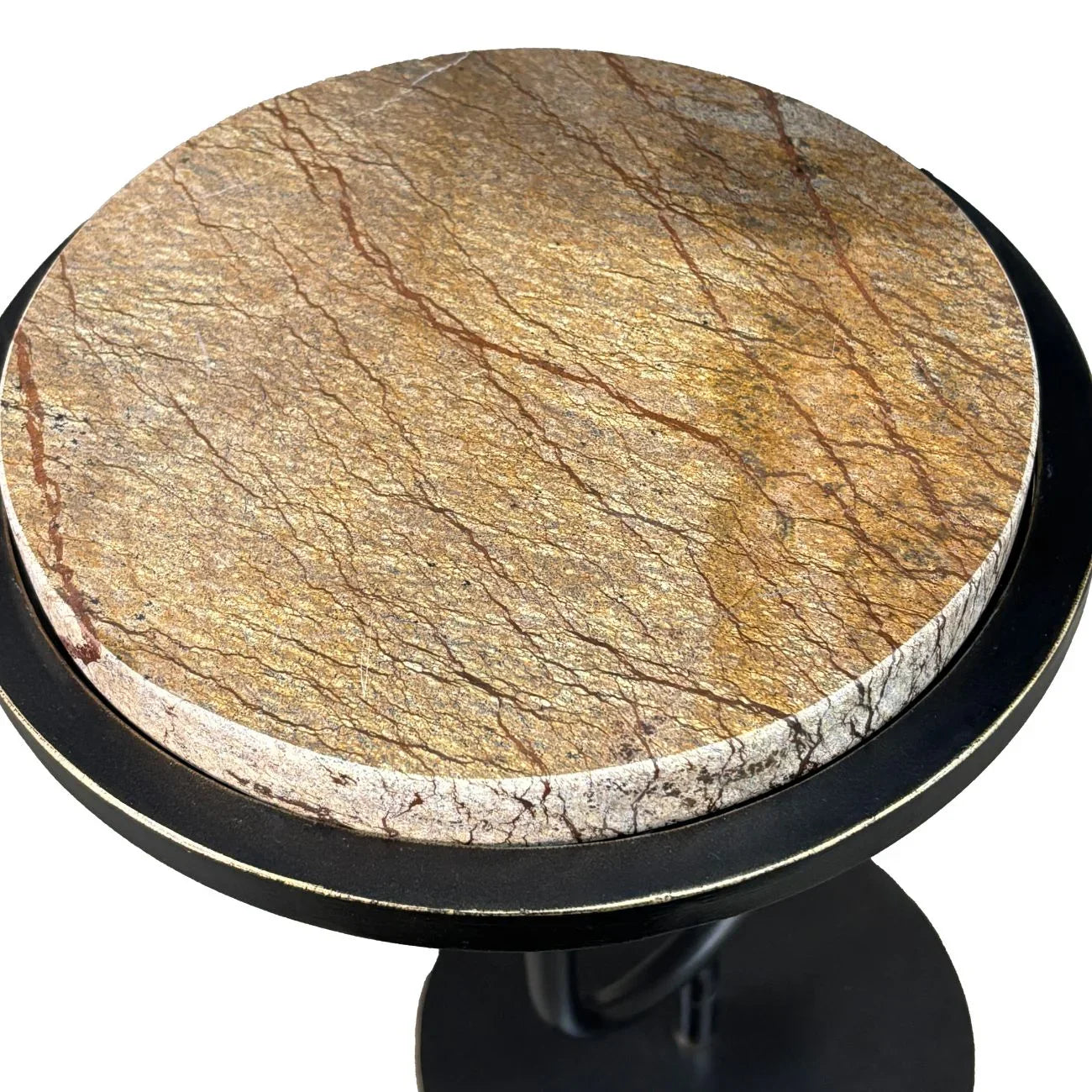 Round stone tabletop with earthy brown and gold veining on a dark base.