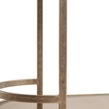Aged gold trolley frame with textured metal finish.