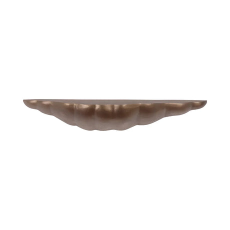 Antique brass floating shelf with scalloped edge design.