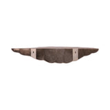 Antique brass shelf with scalloped edge design against white background.