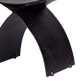 Black iron stool leg with curved design and textured finish.