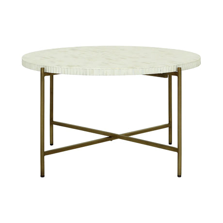 Round bone inlay table with brass legs and intricate surface pattern.