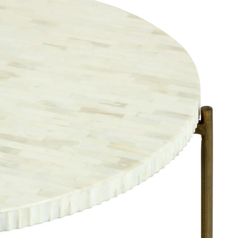 Round table with ivory inlay and brass legs detail.