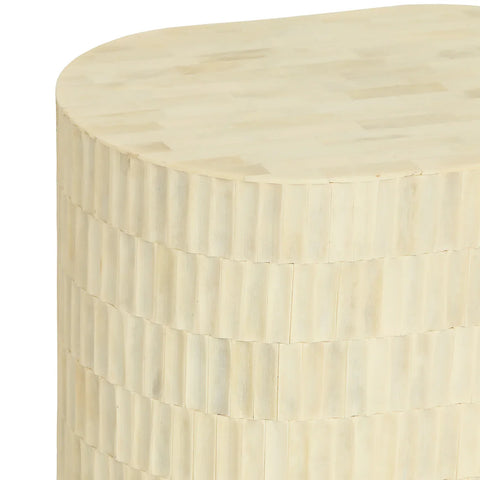Cream side table with intricate bone inlay pattern.