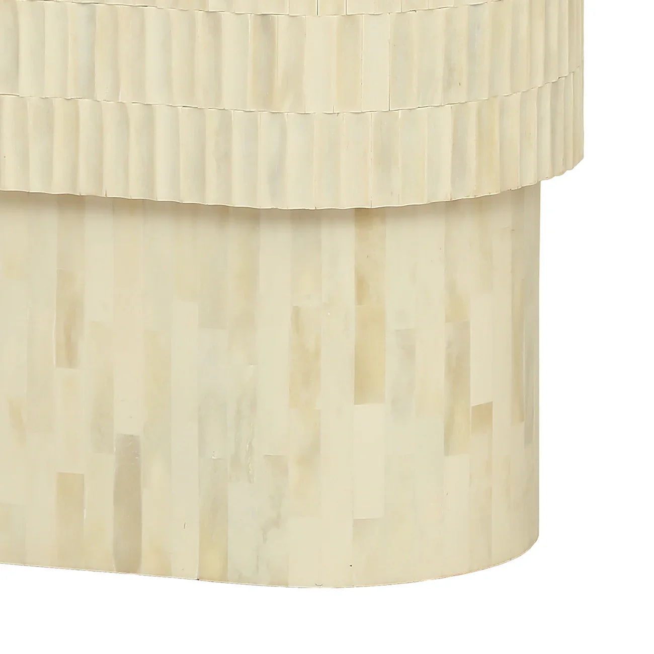 Cream side table with intricate bone inlay pattern and curved edges.