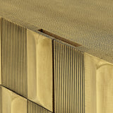 Brass sideboard corner with textured vertical grooves and smooth top surface.