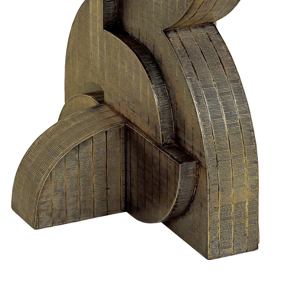 Bronze textured base of dining table with intricate detailing.