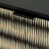 Black and ivory sideboard detail with geometric inlay pattern.