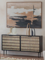 Striped bone inlay sideboard with decor in a modern living room setting.