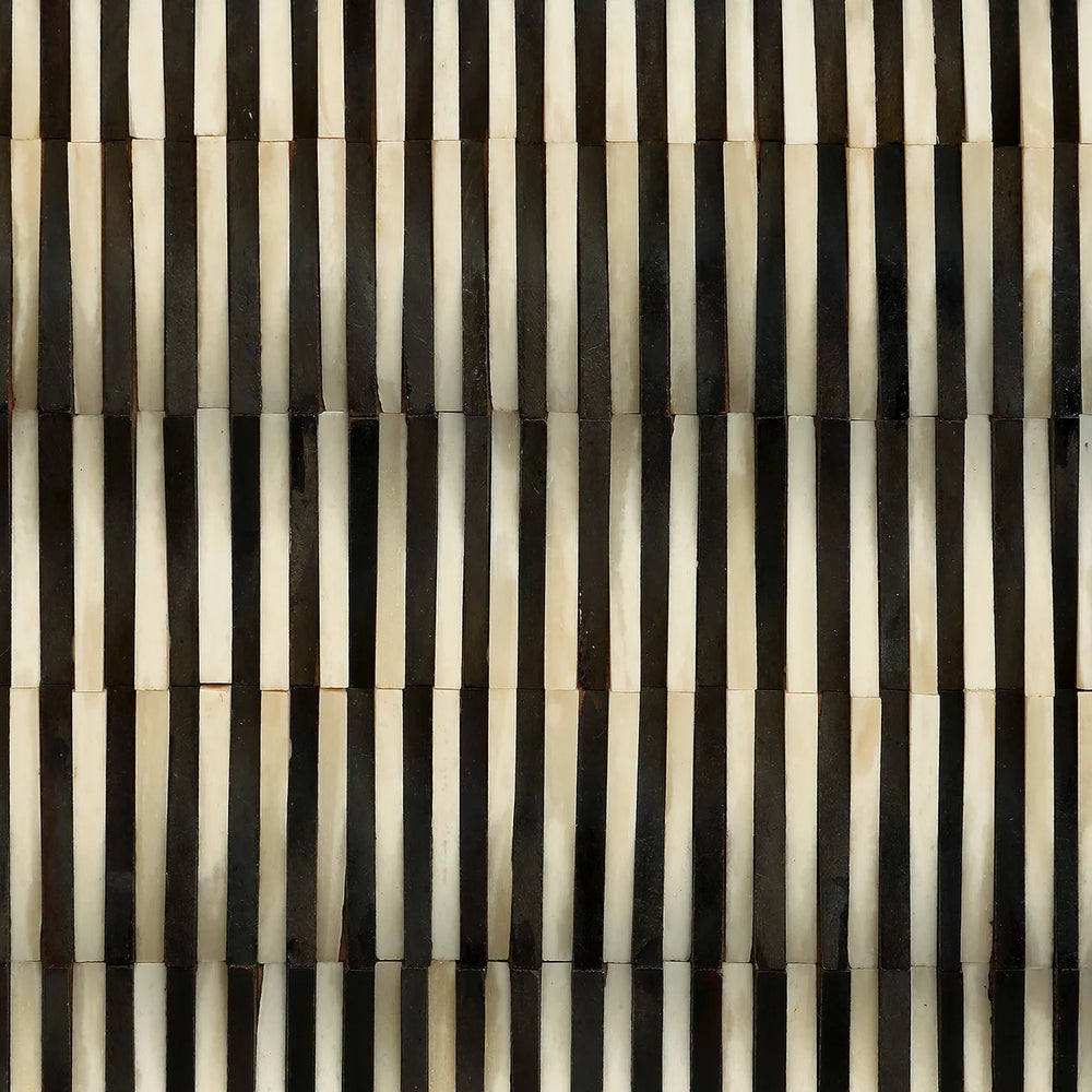 Black and white striped bone inlay pattern detail.