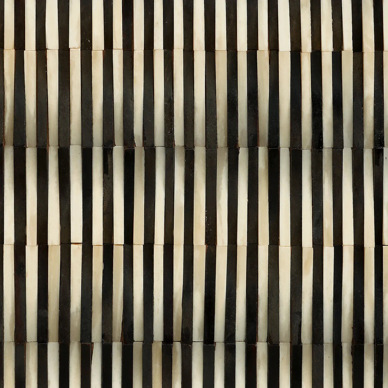 Black and white striped bone inlay pattern detail.