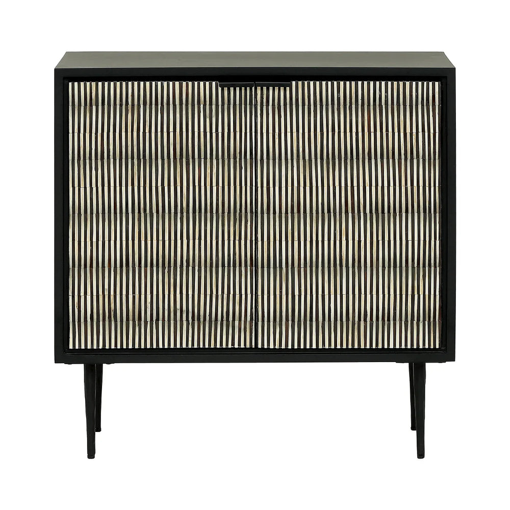 Black and white striped cabinet with slender legs and intricate door pattern.