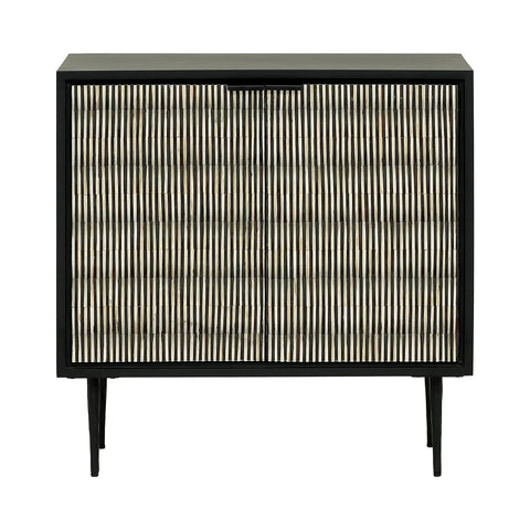 Black and white striped cabinet with slender legs and intricate door pattern.