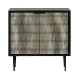 Black and white striped cabinet with slender legs and intricate door pattern.