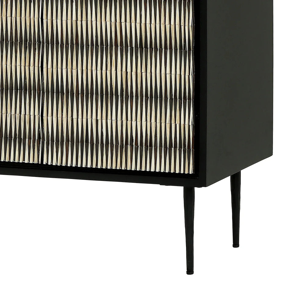 Black cabinet with intricate bone inlay pattern on doors, slender legs.