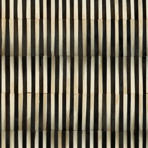 Black and white striped bone inlay pattern detail.