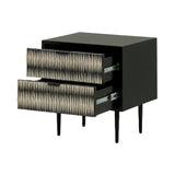 Black bedside table with bone inlay drawers partially open.