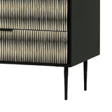 Black chest with intricate bone inlay pattern and slender legs.