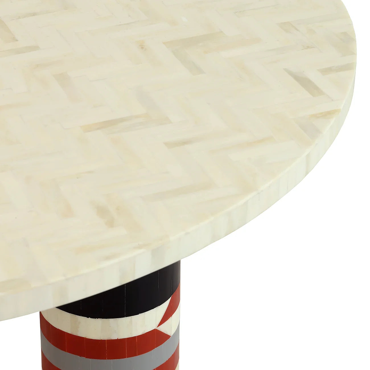 Cream bone inlay table surface with geometric pattern and striped base.
