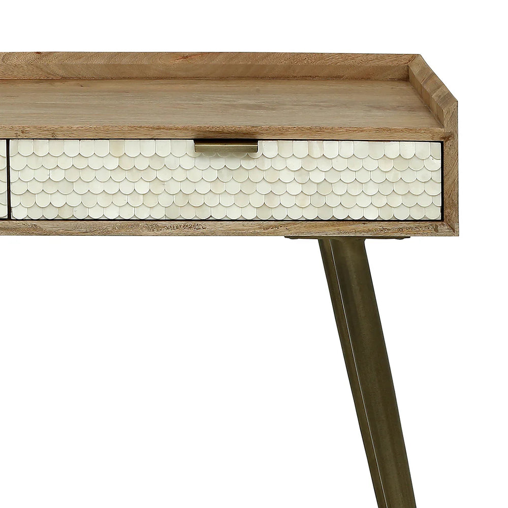 Natural wood desk with scalloped bone inlay drawer detail.