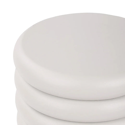 Smooth white table surface with rounded edges and layered design.