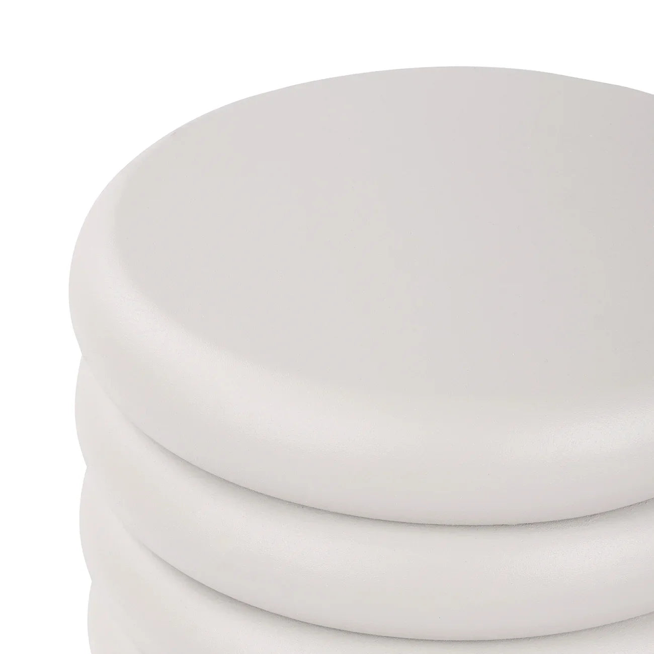 Smooth white table surface with rounded edges and layered design.