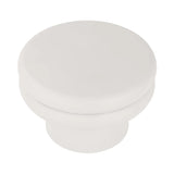 White round coffee table with smooth, minimalist design.