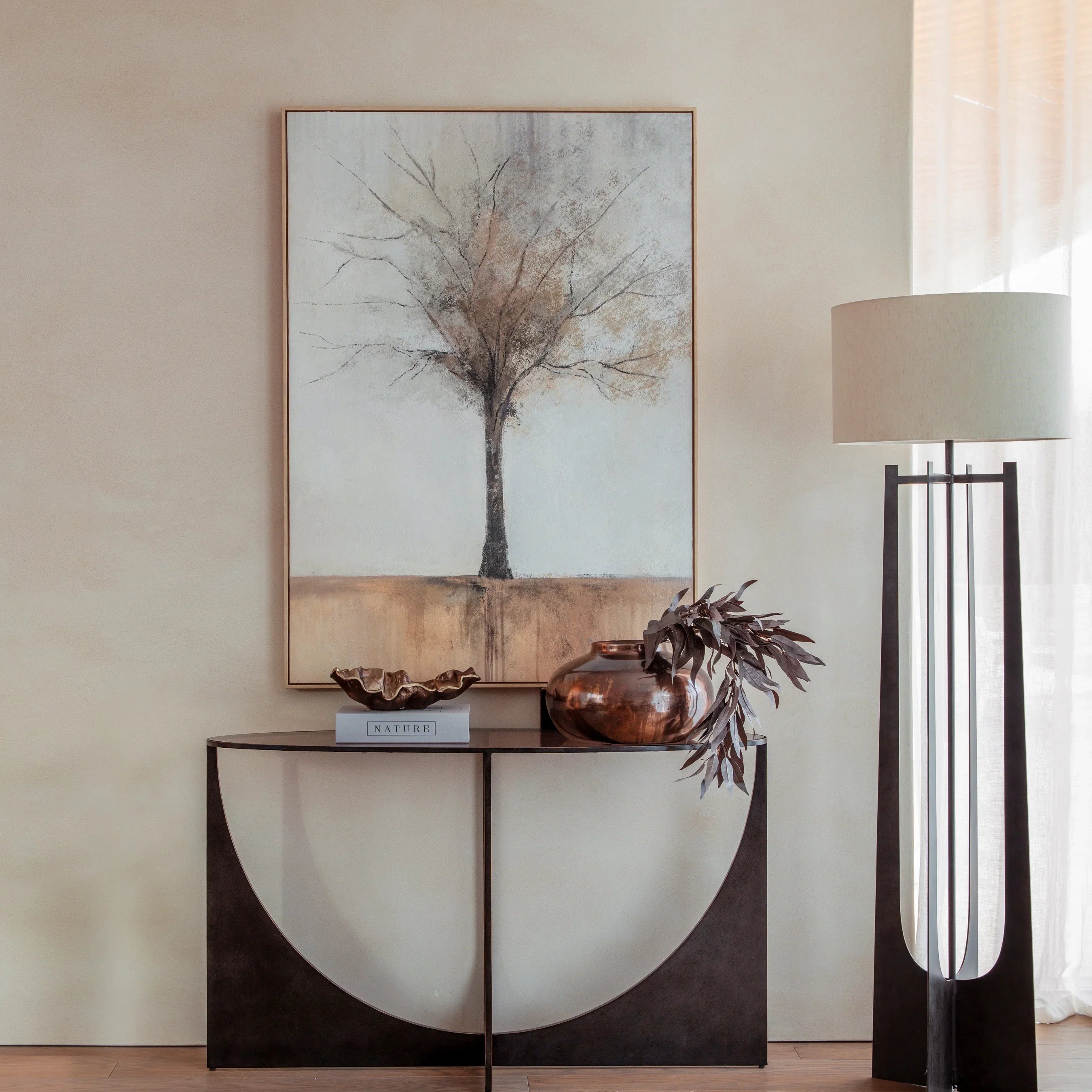 Dark wood console table with decorative items in a modern living room setting.