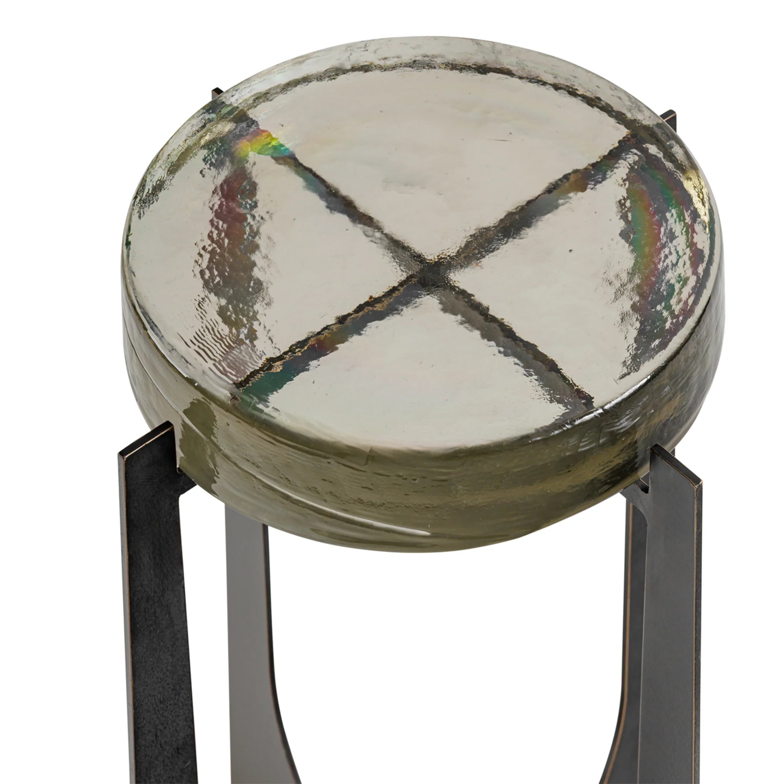 Round glass table top with textured surface and metal legs.